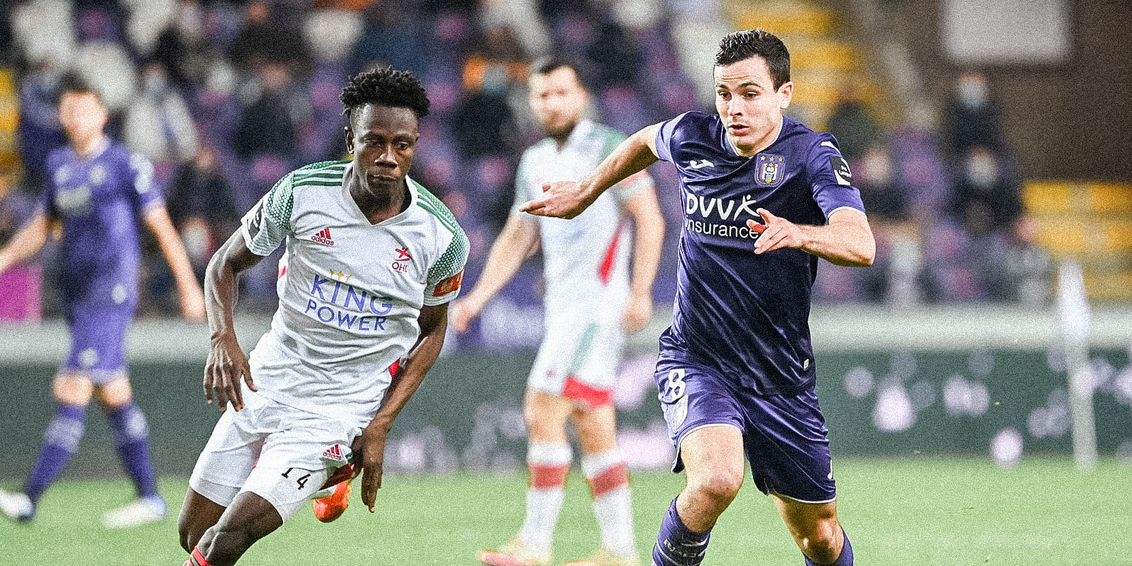 OHL's Xavier Mercier and Anderlecht's Josh Cullen fight for the